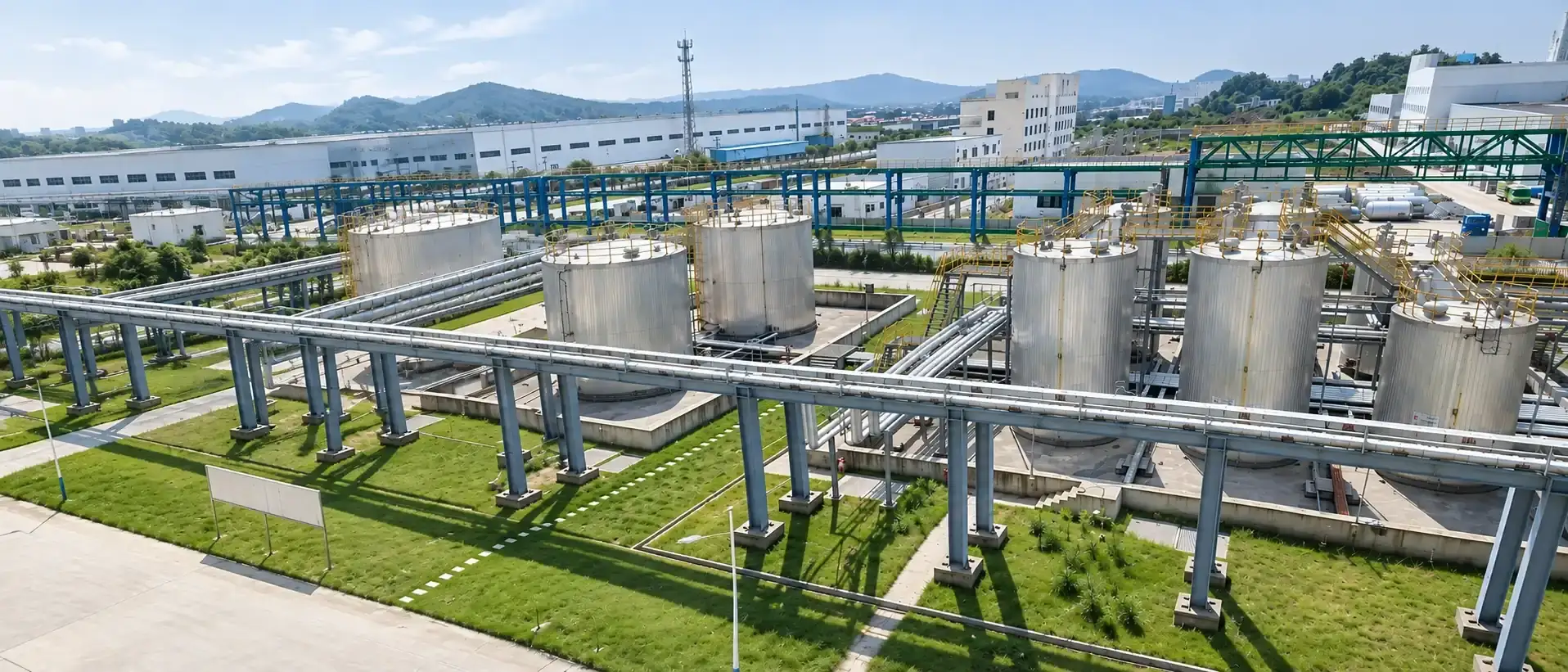 Aerial view of the bulk storage tank farm, pipe racks carrying material from the tanks to the production building