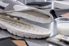 Sole and upper prepared with water-based PU adhesive, with the tub and brush on the bench